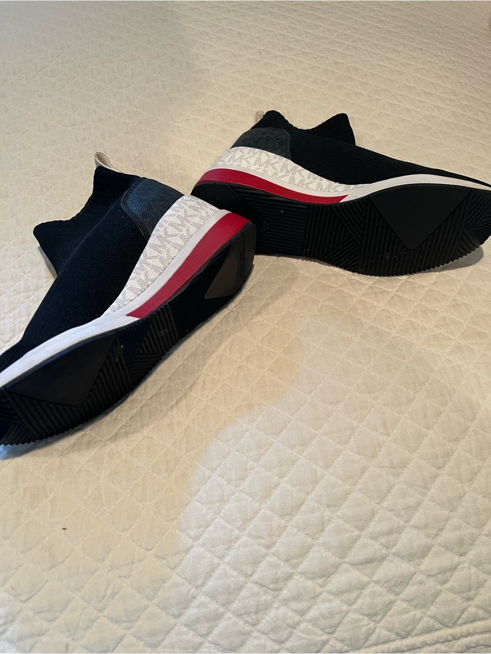 Michael Kors Black Slip-On Knit Sneakers with White and Red Accents